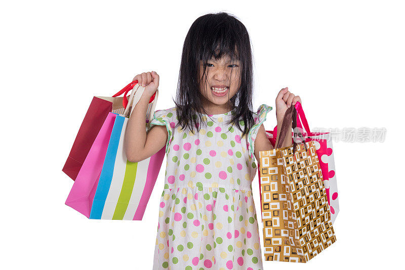 亚洲华人小女孩拿着购物袋