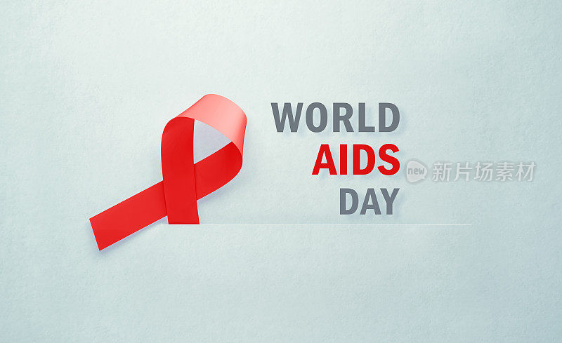 艾滋病宣传丝带旁边是灰色背景的世界艾滋病日信息