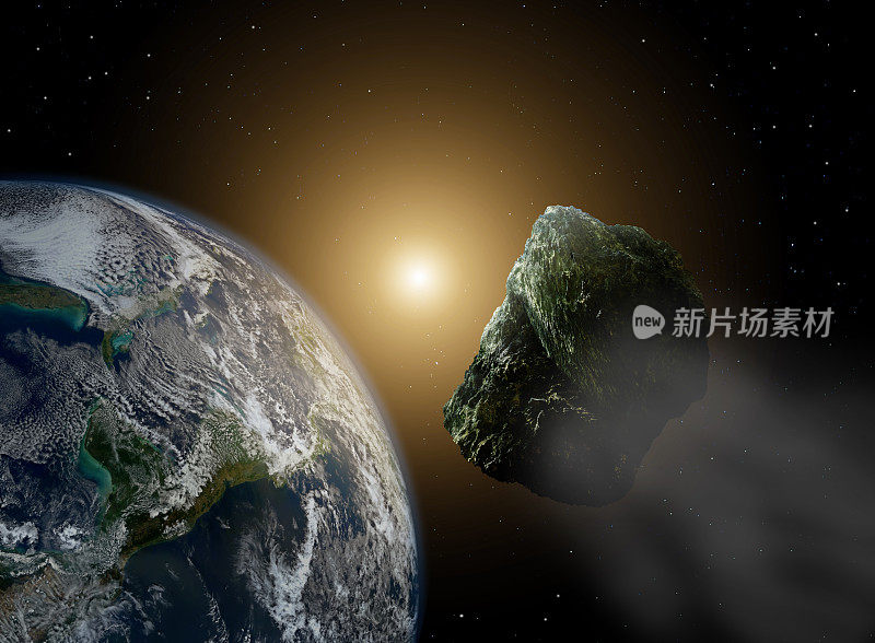 太空中的小行星在阳光下靠近地球