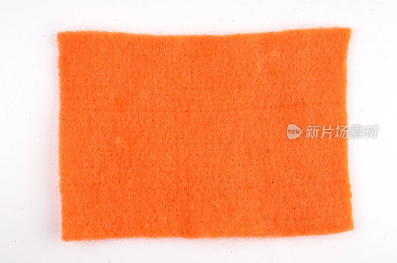 橙色裁剪的纺织品补丁上的白色背景直接上方