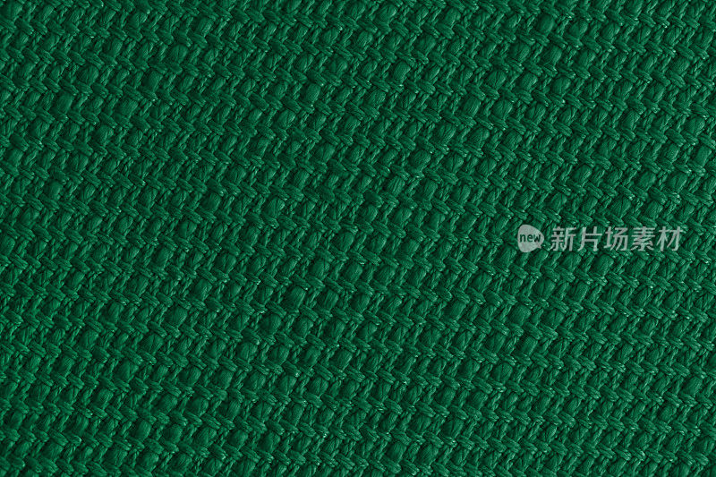 绿色深色背景亚麻纹理编织棉绳黄麻稻草网格图案圣诞节深蓝绿色柳条背景微距摄影