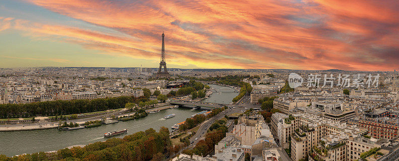 鸟瞰图巴黎城市与塞纳河和戏剧性的天空在日落法国