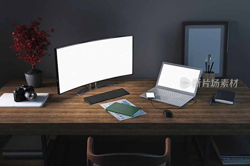 家庭办公用办公桌，配有电脑显示器和笔记本电脑