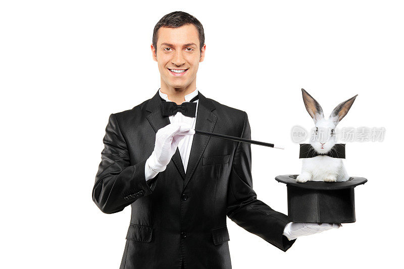 魔术师拿着一顶有兔子的大礼帽