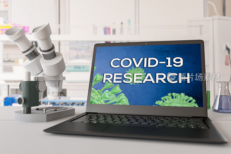 带笔记本电脑和显微镜的Covid-19研究实验室