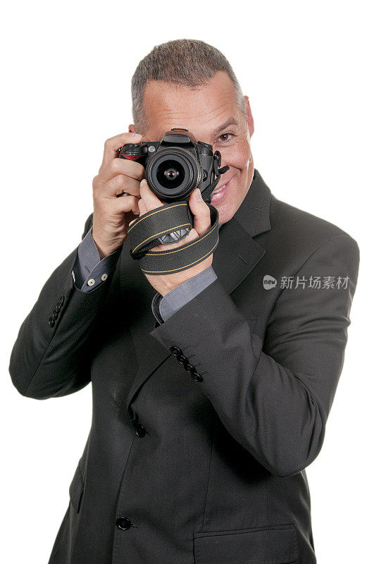 微笑:)一个带着相机的摄影师，正盯着你。