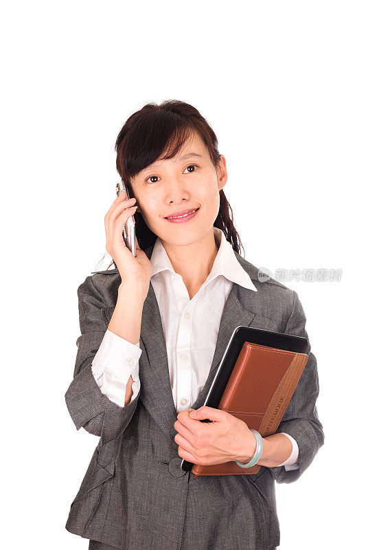 亚洲商业女性在电话孤立