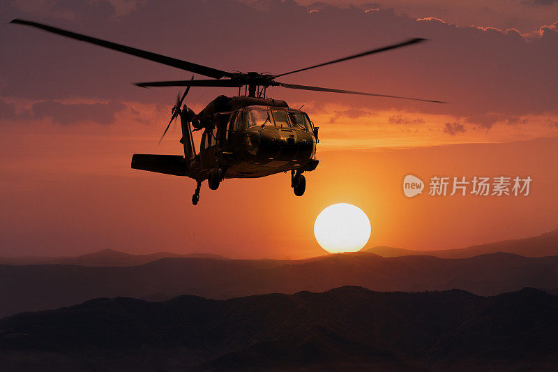 日落背景上的陆军直升机