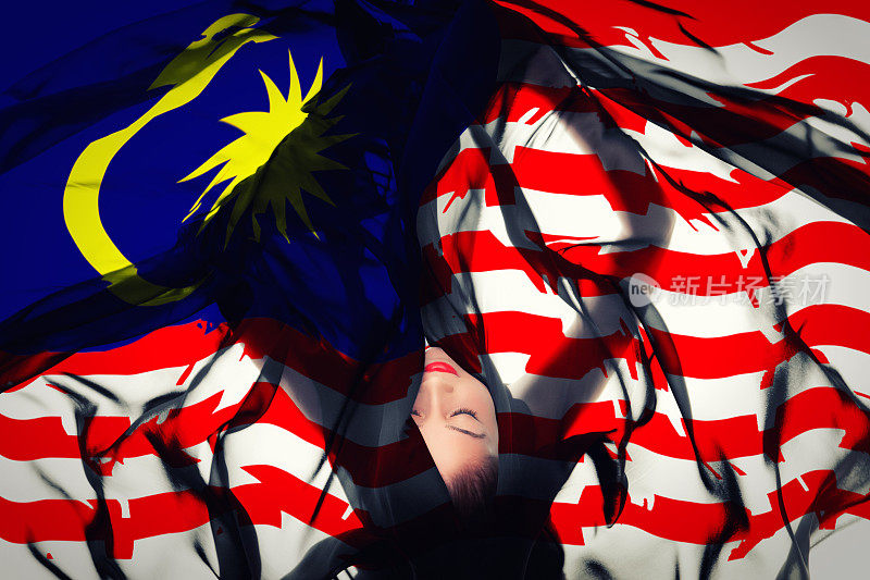 拿着马来西亚国旗的年轻女孩