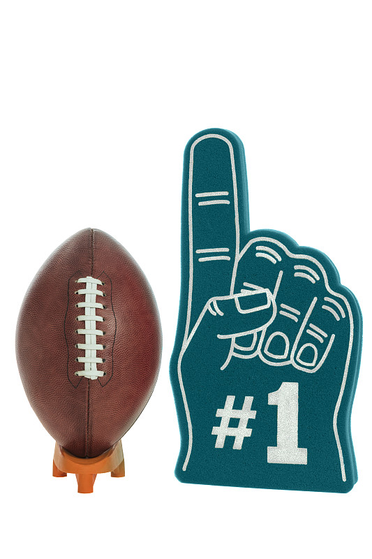 美式足球在一个踢球的t座上有一个大的绿色泡沫#1手指为大比赛