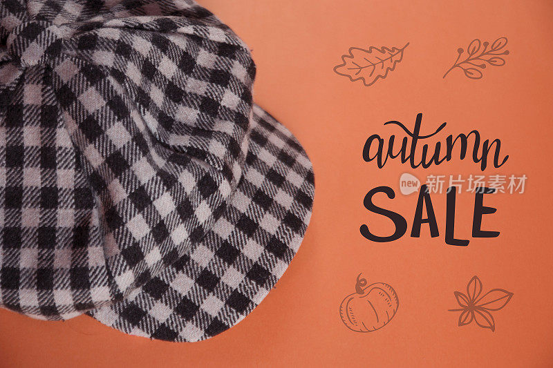 秋季销售旗帜与格子头戴。服装店广告宣传册。男女皆宜的帽子，橙色背景。