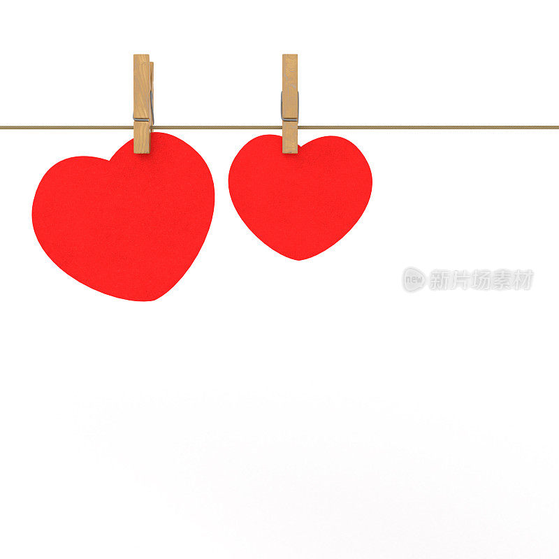 两个木钉和两颗红纸心挂在绳子上。