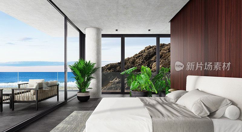 豪华酒店拥有大窗户的现代室内卧室。春景洋边有大岩石。
