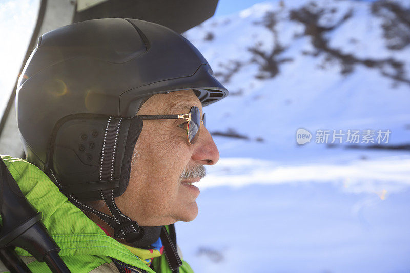 冬季运动肖像高级男子滑雪者在滑雪缆车。粉雪。高山雪景。欧洲阿尔卑斯山脉，高山滑雪。