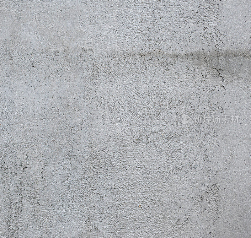 白色的墙壁，纹理不均匀。