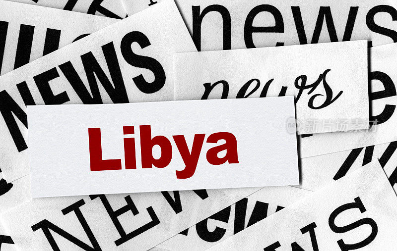 “新闻”一词用不同字体，“利比亚”一词用红色字体居中