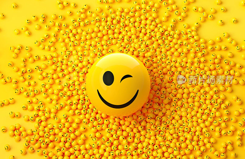 快乐的表情符号被许多黄色背景的表情符号包围