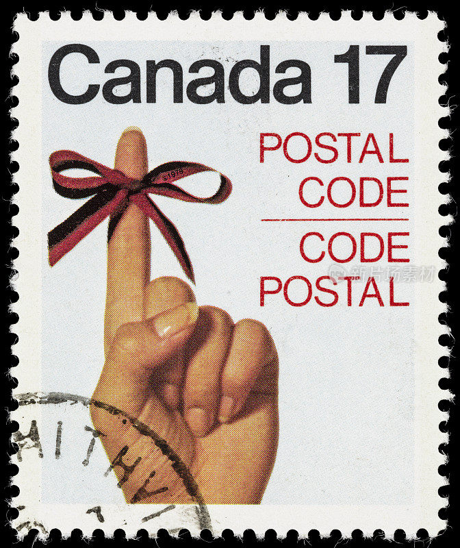 加拿大丝带系在手指邮票上