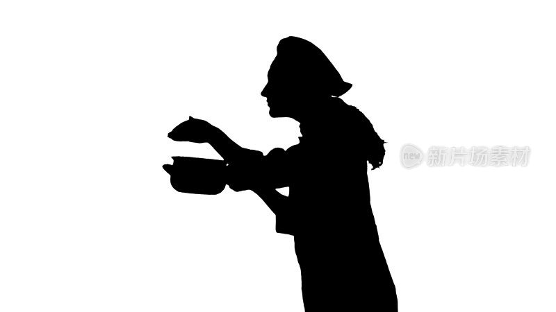 一名女厨师穿着制服闻菜的黑色剪影肖像