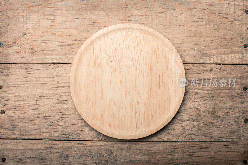 空木盘木质纹理背景可用于披萨盘和复制空间等;