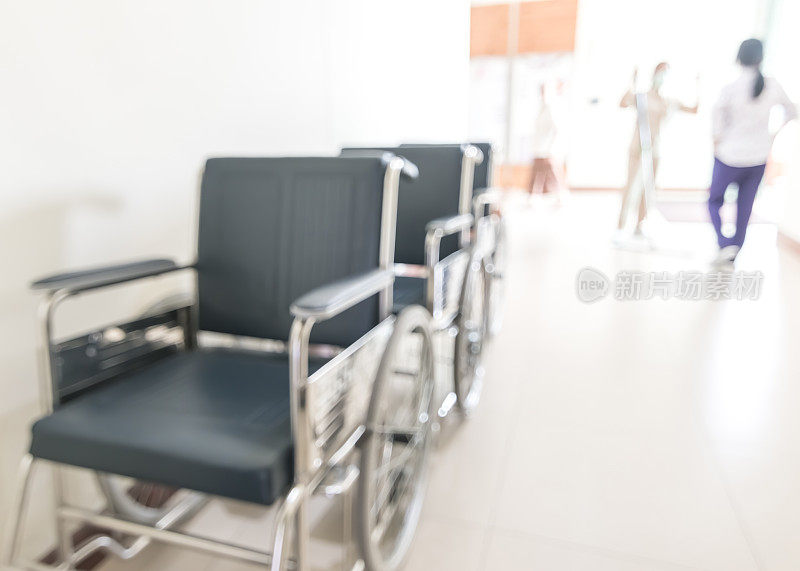轮椅在医院或医疗诊所走廊模糊抽象背景与模糊的透视视图内部走廊服务残疾人和病人的移动