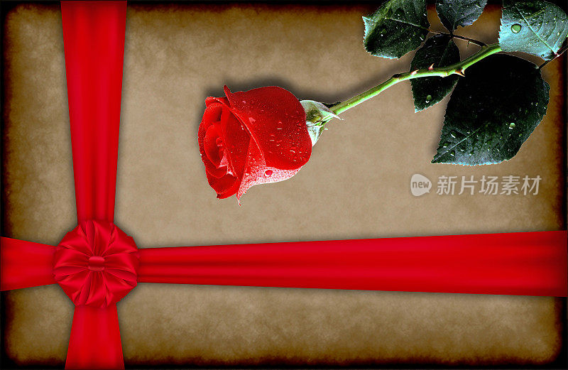 玫瑰和一个旧纸上带蝴蝶结的礼盒。