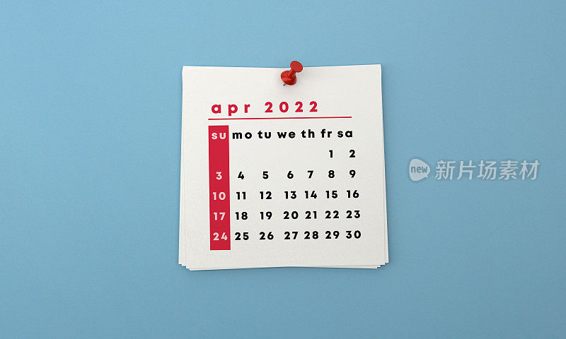 2022年将四月日历贴在蓝色背景上