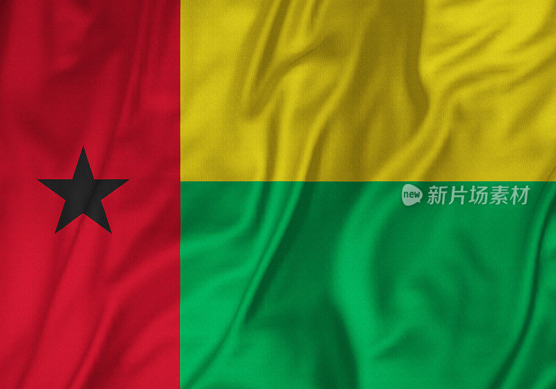 皱褶几内亚比绍国旗的特写，几内亚比绍国旗在风中飘扬