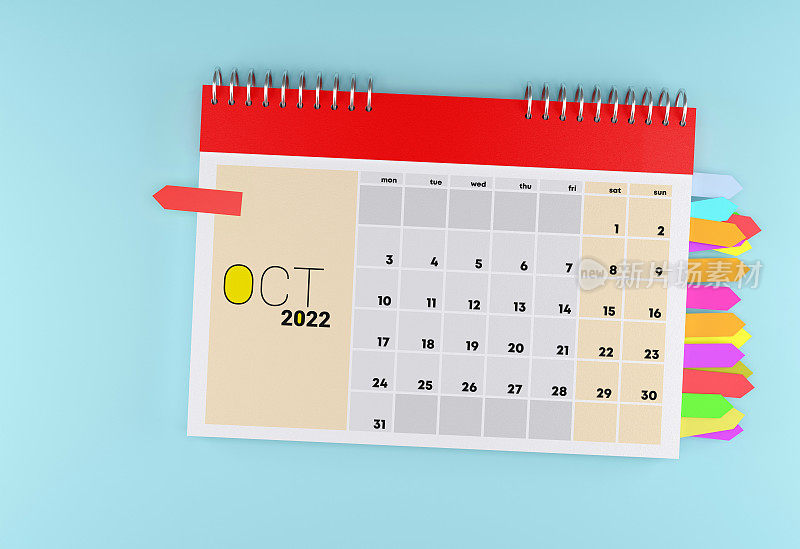 2022年10月日历与便签纸在蓝色背景