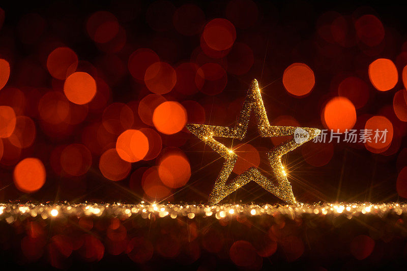 金色圣诞之星-背景散焦金红色散景
