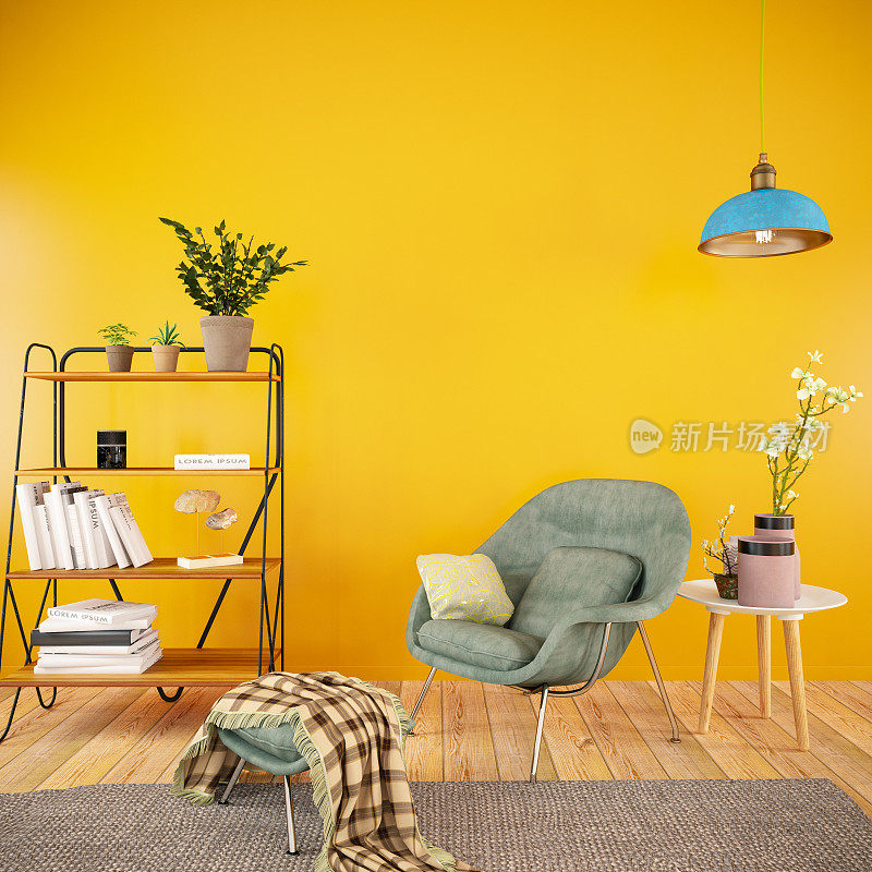 室内有扶手椅和书靠在橙色的墙上