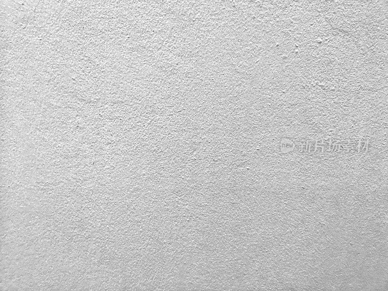 将水泥墙面漆成浅灰色，底色为粗糙抛光表面纹理混凝土材料，底色为抽象灰色，楼面建筑为纸质贺卡