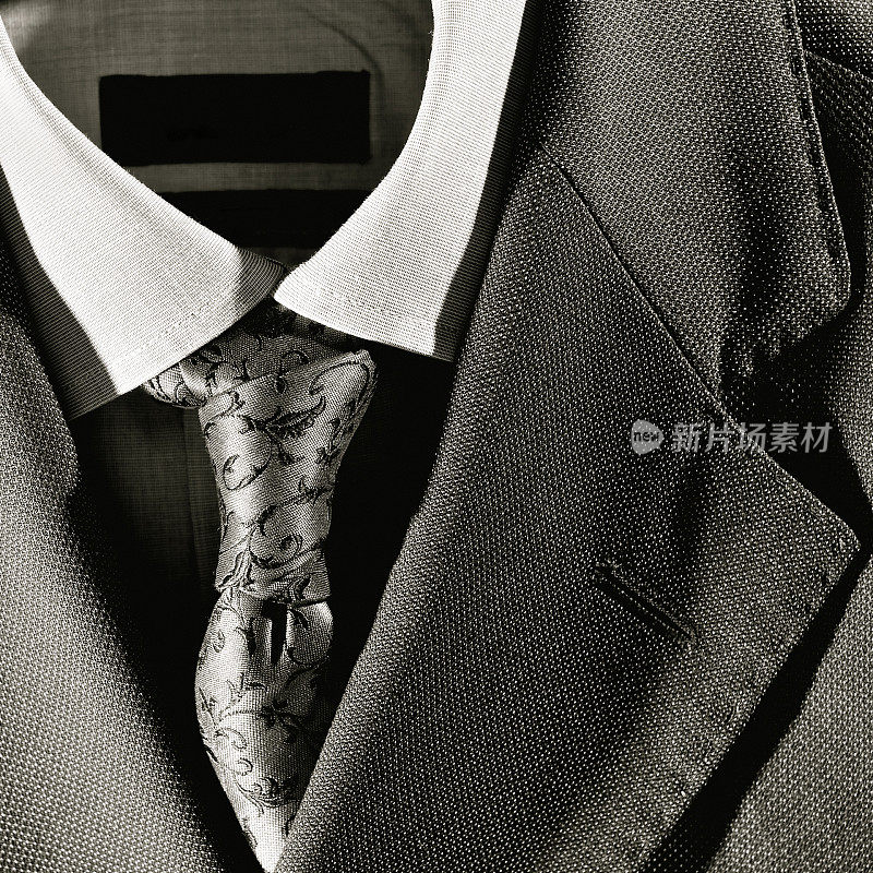 特写的现代西装，纽扣衬衫和领带