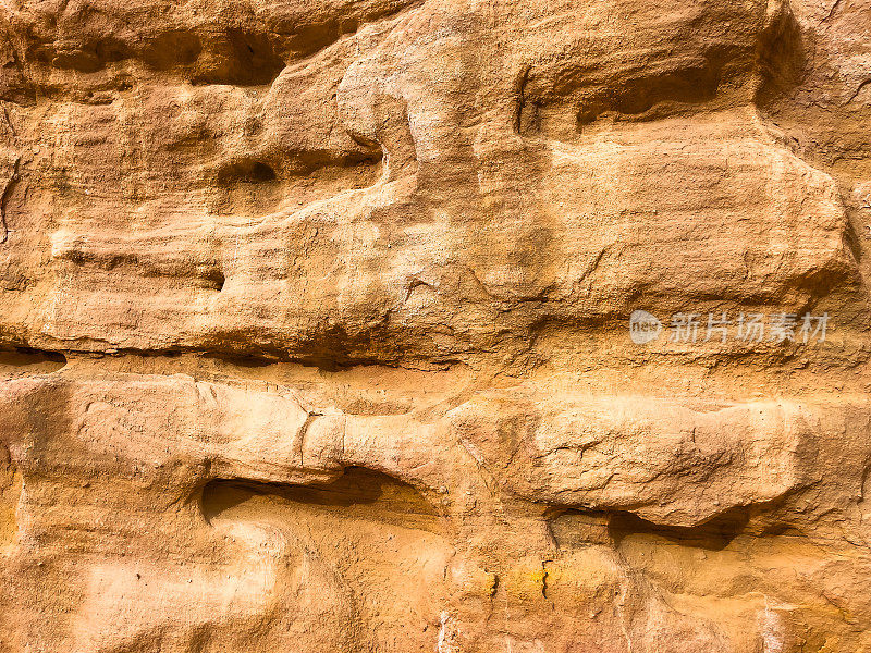 沙漠岩石的特写镜头。沙漠岩石和山的纹理。抽象的图案