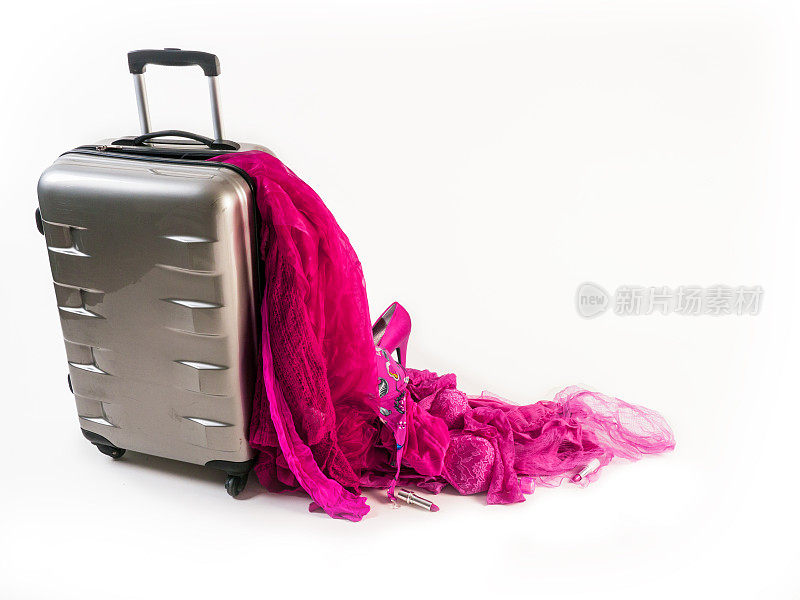 损坏的手提箱转轮失去了它的粉红色女性内容