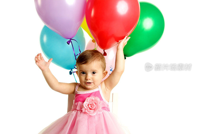 快乐的一岁生日女孩与气球