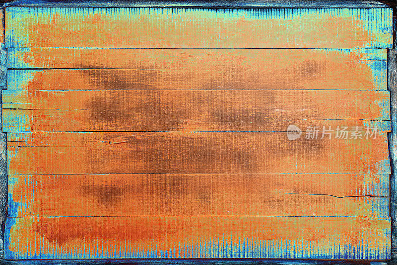 老风化抽象的橙色和绿松石镶板的木材背景与许多木纹和纹理。