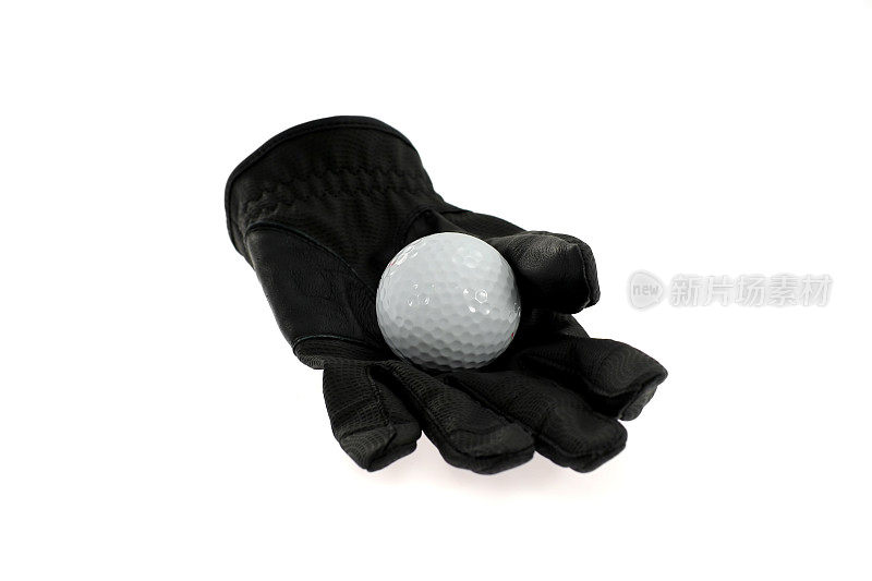 黑色高尔夫手套上的高尔夫球