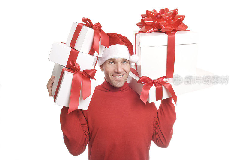 圣诞帽男手持一叠圣诞礼物