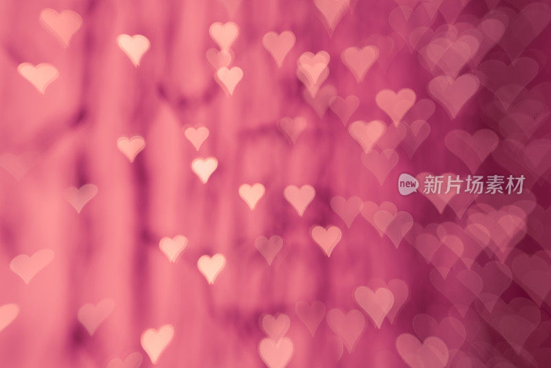粉红色的心-散焦灯抽象散景背景爱情人节庆祝派对