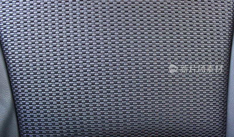 昂贵椅子座椅部分皮革内饰的纤维图案设计详细库存照片