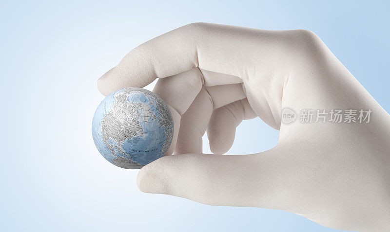 流行的概念。手握着地球。