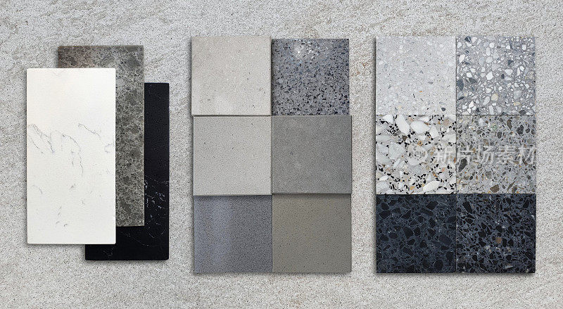 灰色石材背景上的材料施工样例。室内材料设计包含多种颜色和图案的水磨石、颗粒石瓷砖、石英、大理石石材。整理材料。