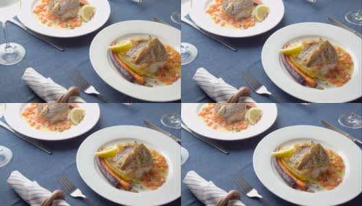 奢华的法式餐厅形象，鲈鱼配白葡萄酒高清在线视频素材下载