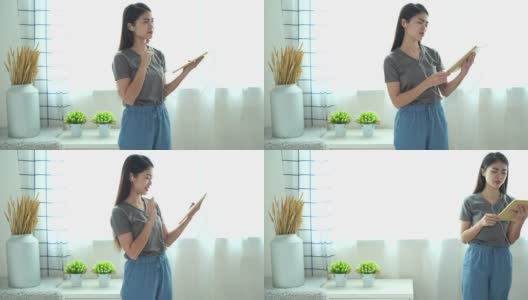 亚洲妇女与她的朋友在视频聊天会议，远距离交流。高清在线视频素材下载
