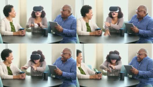 年轻女子戴着虚拟现实头盔，父母在一旁看着高清在线视频素材下载