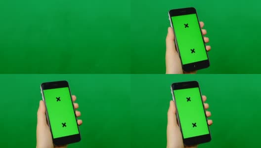 绿色背景上的空白绿色屏幕手机。高清在线视频素材下载