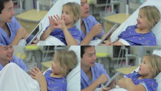 重症监护室的小女孩和男护士谈话高清在线视频素材下载