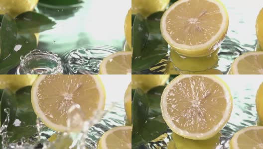 柠檬半片碰到淡水表面。慢动作镜头高清在线视频素材下载