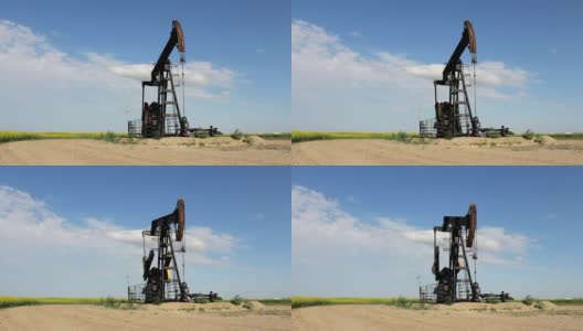 加拿大草原上的油泵高清在线视频素材下载